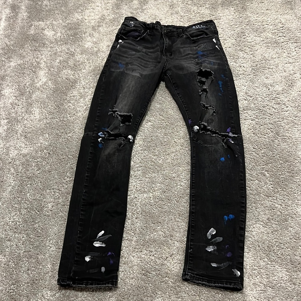 black jeans with paint